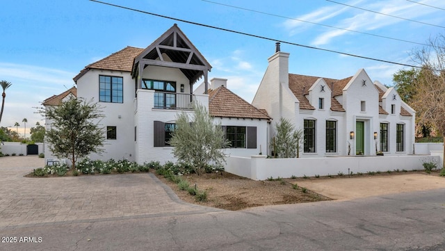 view of front of property with a balcony