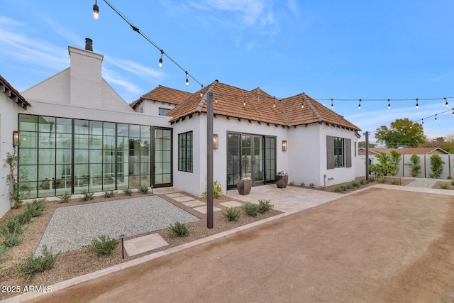 back of house with a patio area