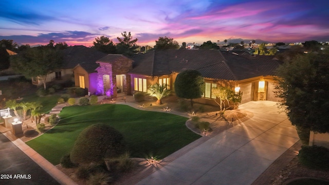 view of front of property with a yard