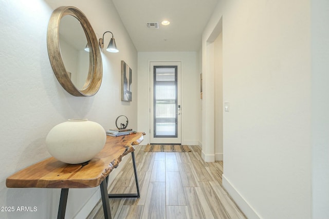 entryway with light hardwood / wood-style flooring