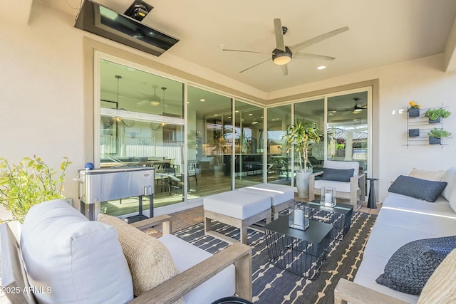 view of patio with ceiling fan and an outdoor living space