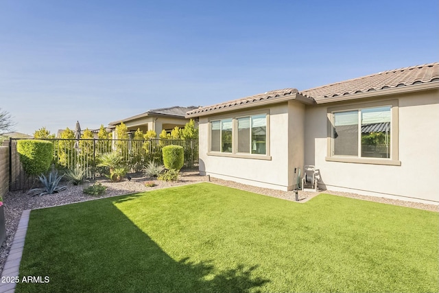 rear view of property featuring a yard