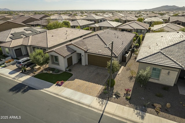 birds eye view of property with a mountain view