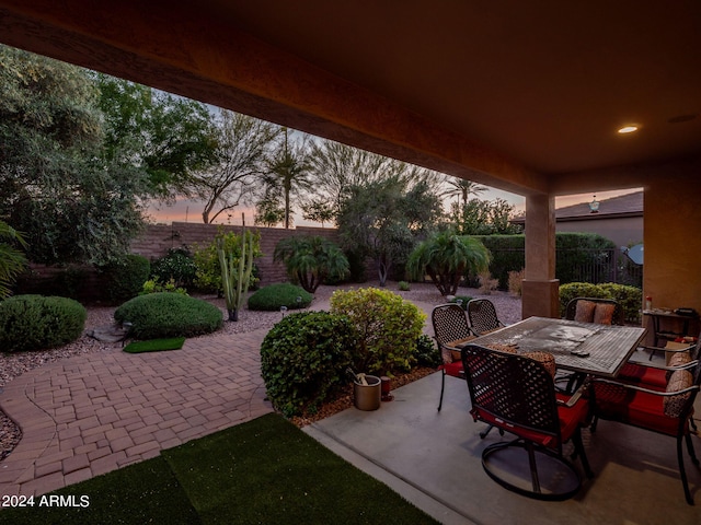 view of patio terrace at dusk