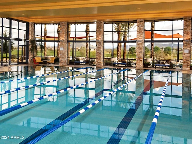 view of swimming pool with a lanai