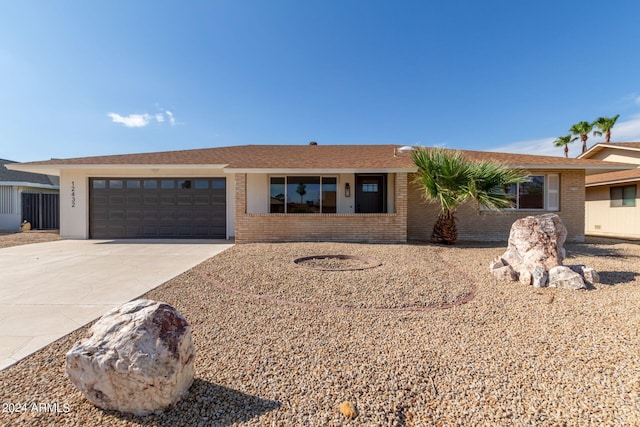 ranch-style house featuring a garage