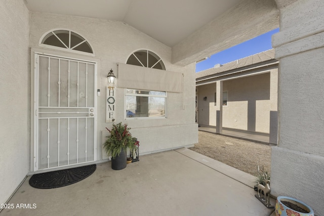 property entrance with a patio