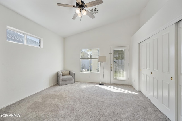 unfurnished room featuring vaulted ceiling, light carpet, and ceiling fan