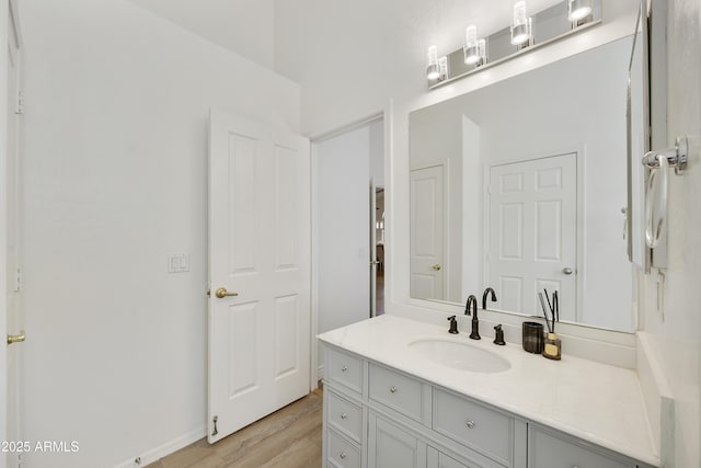 bathroom with vanity and hardwood / wood-style floors