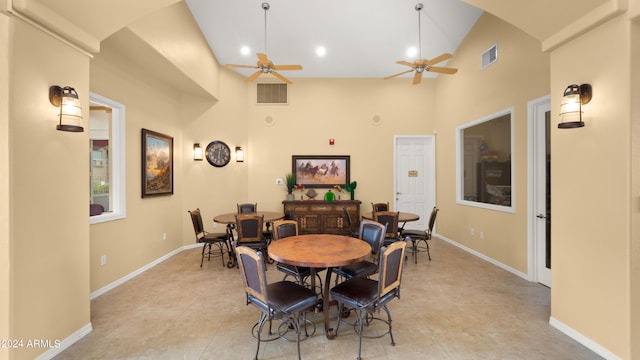 dining area featuring ceiling fan and high vaulted ceiling