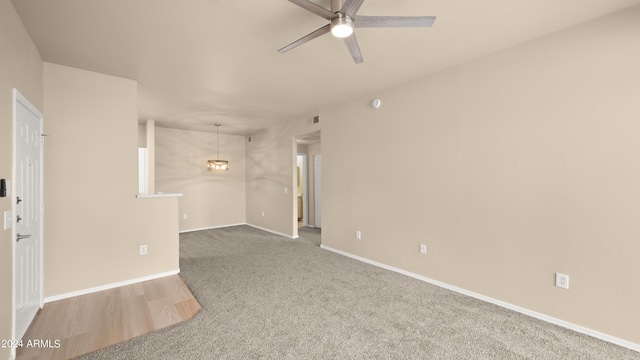 empty room with carpet flooring and ceiling fan