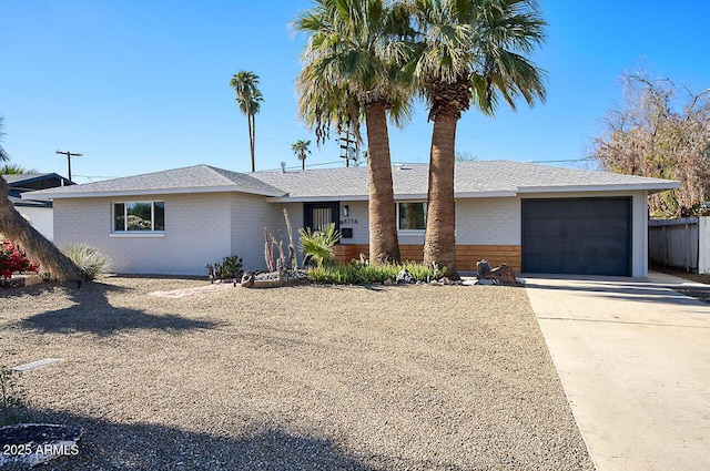 4714 N Miller Rd, Scottsdale, AZ 85251 - ranch-style house featuring concrete driveway, an attached garage, and brick siding