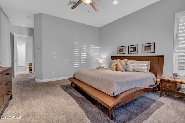 bedroom featuring ceiling fan and light carpet