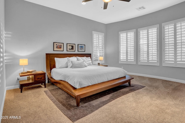 bedroom featuring ceiling fan and light carpet