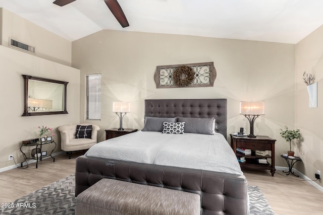 bedroom featuring vaulted ceiling, ceiling fan, and light wood-type flooring