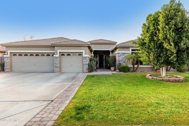 view of front of home with a garage and a front lawn