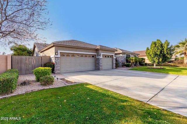 view of front of house featuring a garage and a front yard