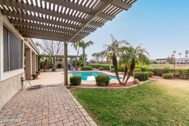 view of swimming pool featuring a patio, a yard, and a pergola