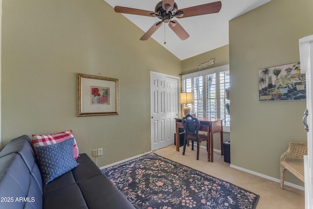 interior space with ceiling fan, vaulted ceiling, carpet, and baseboards