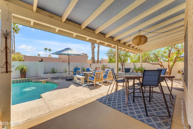 view of patio featuring a fenced in pool, outdoor dining space, and a fenced backyard