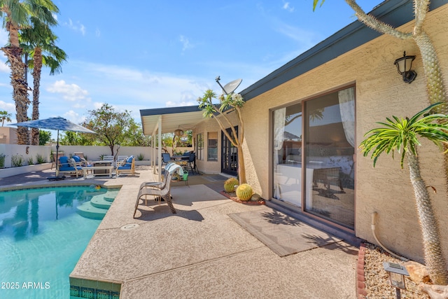 view of swimming pool with fence, a patio area, and a fenced in pool