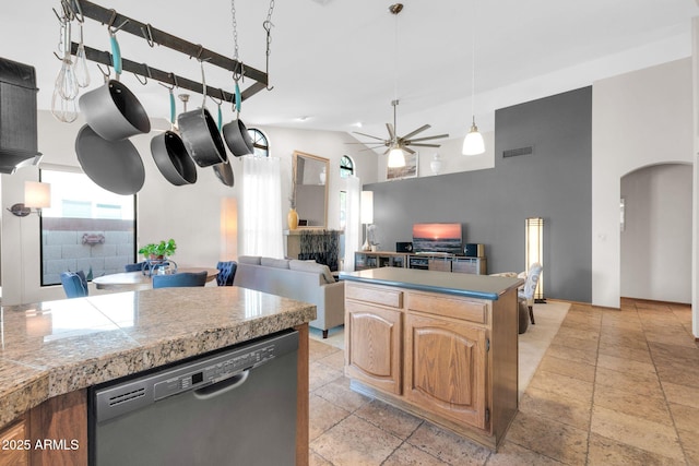 kitchen with visible vents, high vaulted ceiling, tile countertops, dishwasher, and ceiling fan