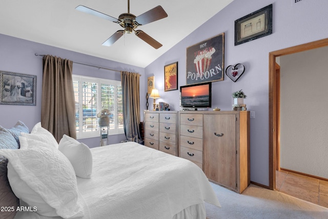 bedroom featuring vaulted ceiling, a ceiling fan, baseboards, and light carpet