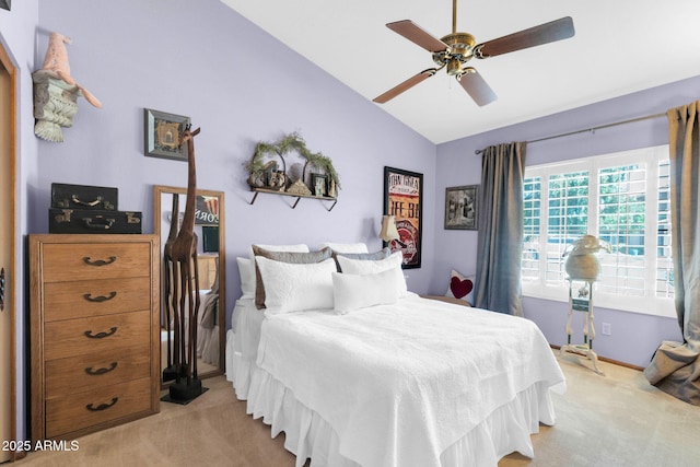 bedroom with baseboards, a ceiling fan, carpet, and vaulted ceiling