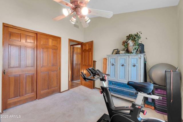 workout area with visible vents, light colored carpet, baseboards, and ceiling fan