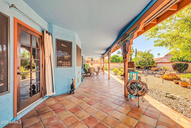 view of patio featuring fence