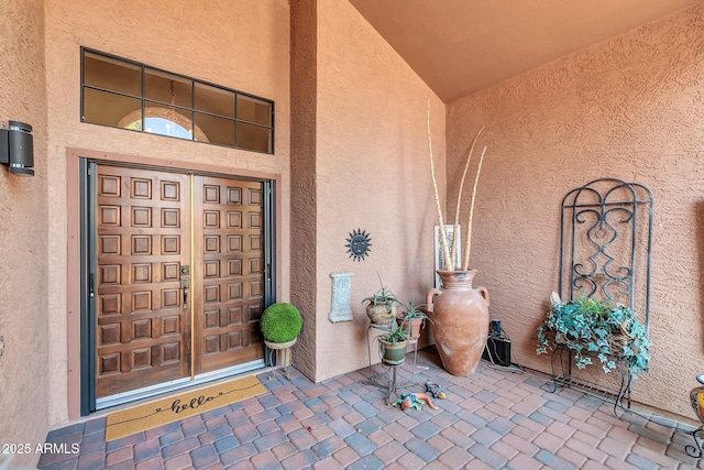 doorway to property with stucco siding