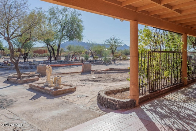 view of patio / terrace with a mountain view