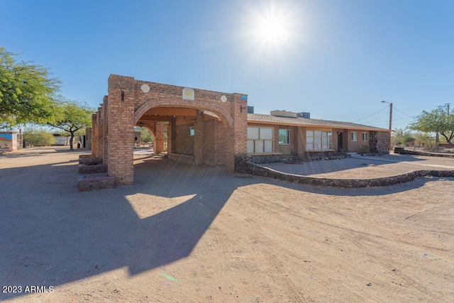 view of front of home featuring a carport