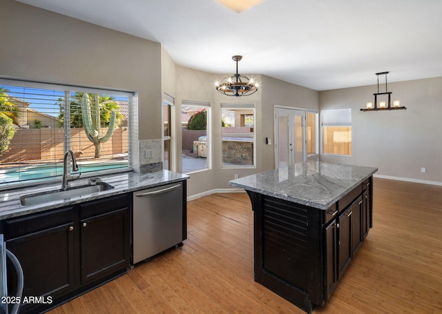 4753 E Bighorn Ave, Phoenix, AZ 85044 - kitchen featuring stainless steel dishwasher, a sink, a chandelier, and plenty of natural light