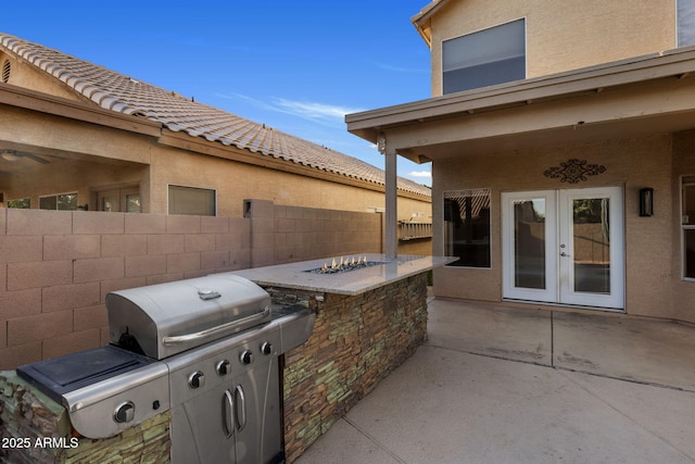 4753 E Bighorn Ave, Phoenix, AZ 85044 - view of patio / terrace with french doors, fence, a fire pit, and a grill