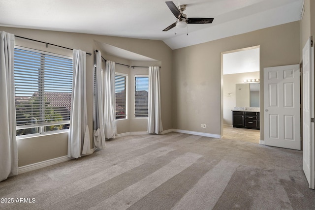 4753 E Bighorn Ave, Phoenix, AZ 85044 - unfurnished bedroom with light carpet, lofted ceiling, baseboards, connected bathroom, and a ceiling fan