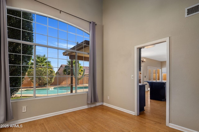 4753 E Bighorn Ave, Phoenix, AZ 85044 - spare room featuring wood finished floors and baseboards
