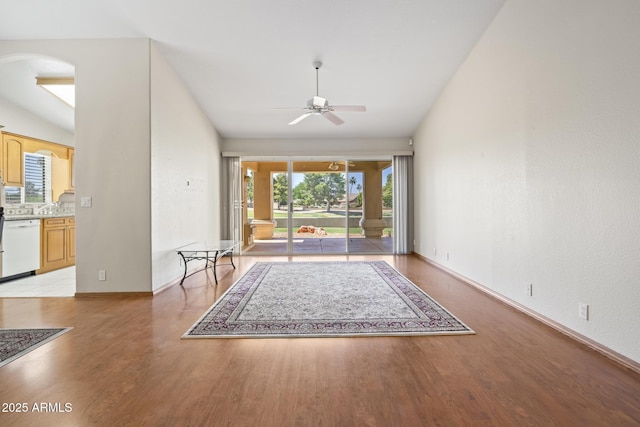 8431 W Utopia Rd, Peoria, AZ 85382 - unfurnished living room with ceiling fan, light wood-type flooring, and arched walkways