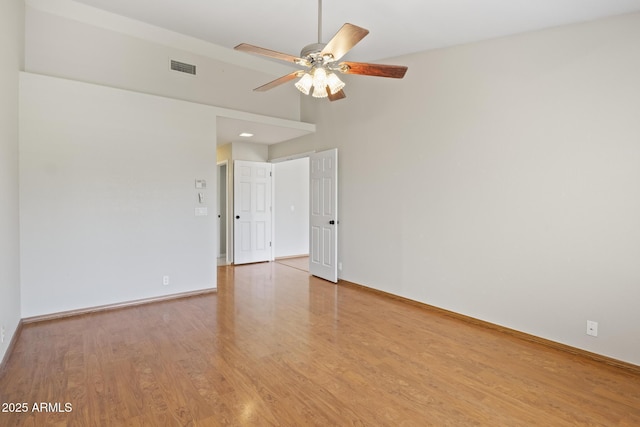8431 W Utopia Rd, Peoria, AZ 85382 - empty room featuring a ceiling fan, wood finished floors, and a high ceiling