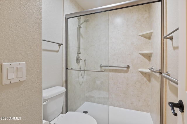 8431 W Utopia Rd, Peoria, AZ 85382 - bathroom featuring a stall shower and a textured wall