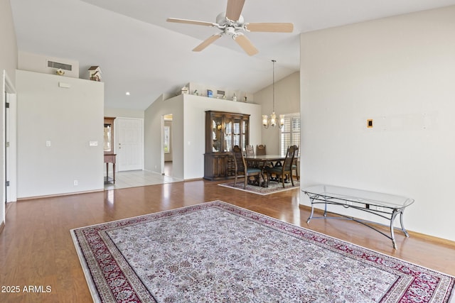 8431 W Utopia Rd, Peoria, AZ 85382 - living area featuring wood finished floors, lofted ceiling, a chandelier, and a ceiling fan