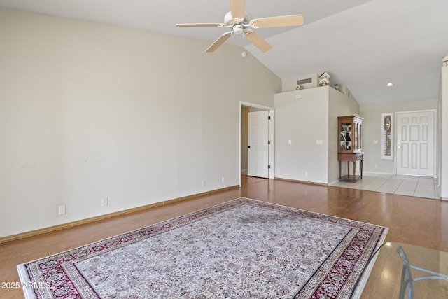 8431 W Utopia Rd, Peoria, AZ 85382 - unfurnished living room featuring a ceiling fan, wood finished floors, and high vaulted ceiling