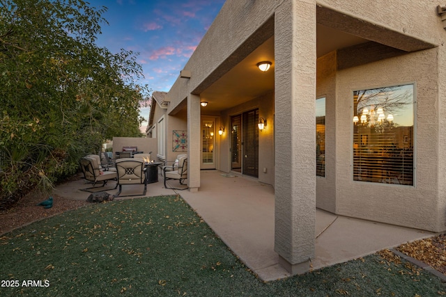 view of patio terrace at dusk