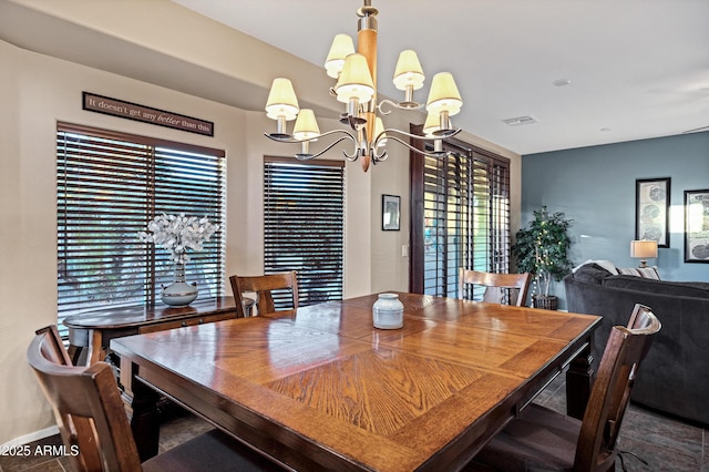 dining area featuring a chandelier