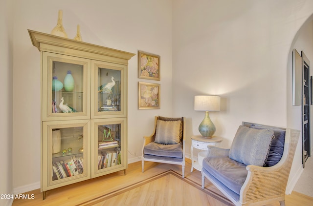 sitting room with hardwood / wood-style floors