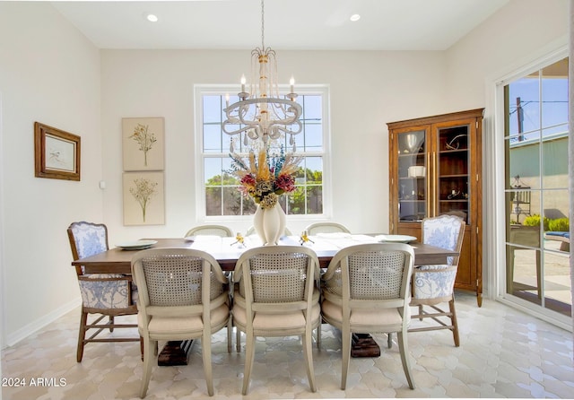 dining room featuring a notable chandelier and a wealth of natural light