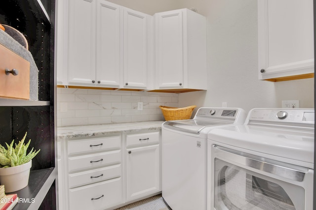 laundry area with cabinets and separate washer and dryer