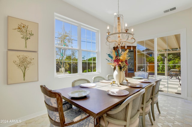 dining area featuring a chandelier