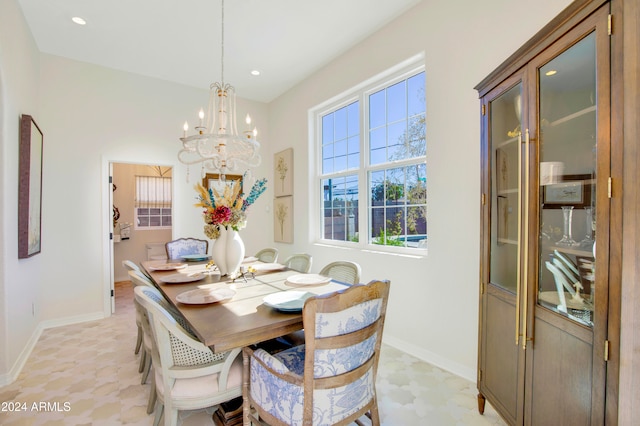 dining area featuring an inviting chandelier