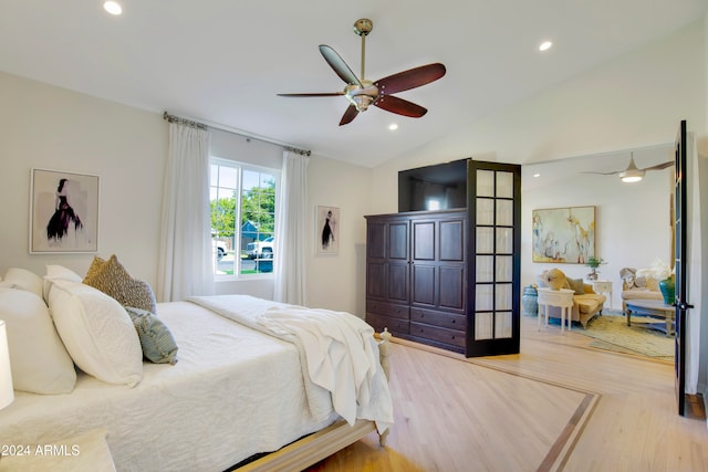 bedroom with vaulted ceiling, wood-type flooring, and ceiling fan